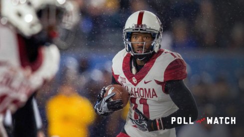 Nov 19, 2016; Morgantown, WV, USA; Oklahoma Sooners wide receiver Dede Westbrook (11) runs the ball during the first quarter against the West Virginia Mountaineers at Milan Puskar Stadium. Mandatory Credit: Ben Queen-USA TODAY Sports