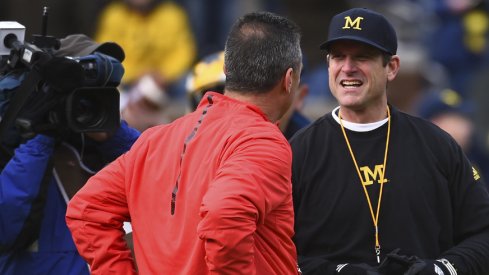 Nov 28, 2015; Ann Arbor, MI, USA; Ohio State Buckeyes head coach Urban Meyer and Michigan Wolverines head coach Jim Harbaugh prior to the game at Michigan Stadium. Mandatory Credit: Tim Fuller-USA TODAY Sports