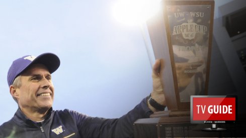 Nov 25, 2016; Pullman, WA, USA; Washington Huskies head coach Chris Petersen hands off the the Apple Cup Trophy after a game against the Washington State Cougars after a game at Martin Stadium. The Huskies won 45-17. Mandatory Credit: James Snook-USA TODAY Sports