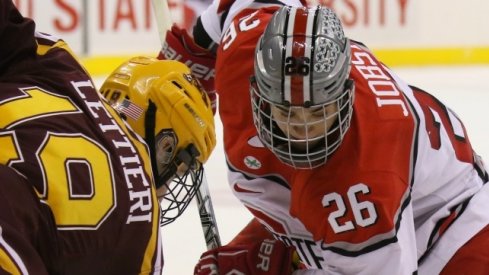 Ohio State's Mason Jobst faces off against Minnesota's Vinni Lettieri.