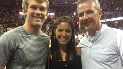 Father Corey Dennis, mother Nicki Meyer and grandpa Urban Meyer