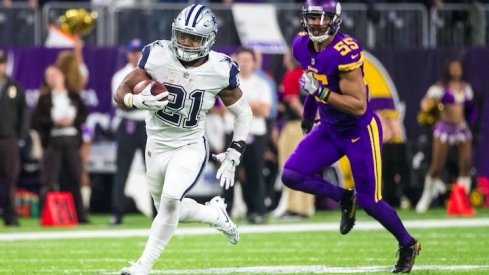 Ezekiel Elliott runs against the Minnesota Vikings.