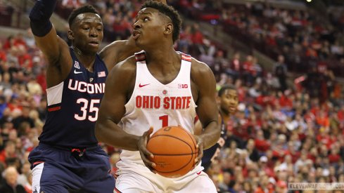 Ohio State's Jae'Sean Tate drives inside against Connecticut.