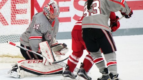 Ohio State goalie Kaylee Remington fends off a Wisconsin shot.