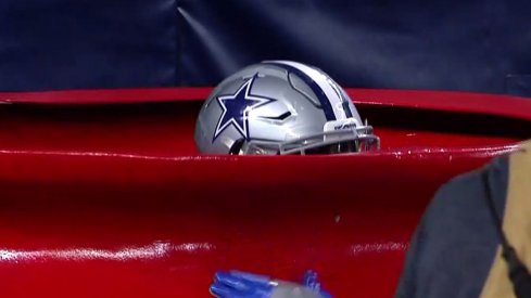 Ezekiel Elliott, just hanging out in a Salvation Army bucket.