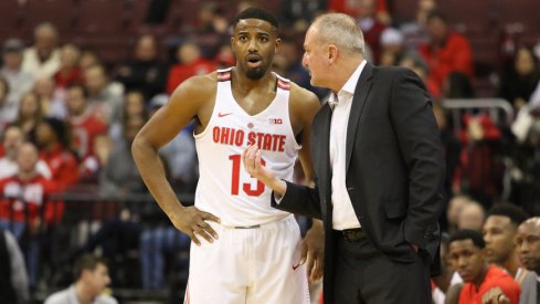 Ohio State coach Thad Matta talks with point guard JaQuan Lyle. 