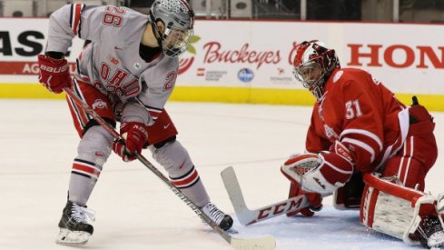 Ohio State forward Mason Jobst scores a goal on Miami goalie Ryan Larkin.