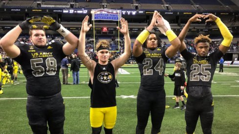 Josh Myers, Tate Martell, Chase Young and Shaun Wade spell out O-H-I-O