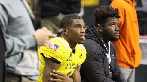 Jeffery Okudah and Marvin Wilson look on at the Army All-American Bowl.