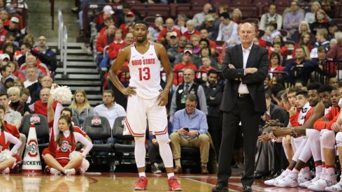 JaQuan Lyle and Thad Matta stand in front of Ohio State's bench earlier this season.