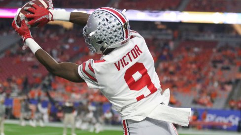 Binjimen Victor warms up before the Fiesta Bowl