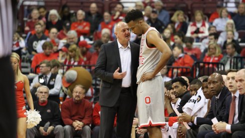 Thad Matta talks with Trevor Thompson during a game earlier this season. 