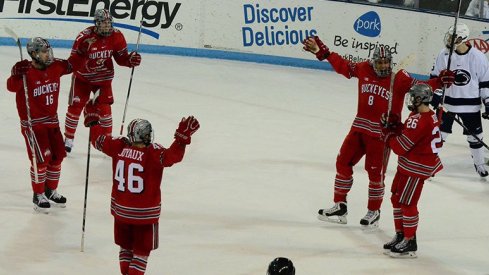 Ohio State men's hockey celebrates in a shootout win over Penn State.