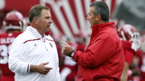 Kevin Wilson speaks with Urban Meyer in 2015. 