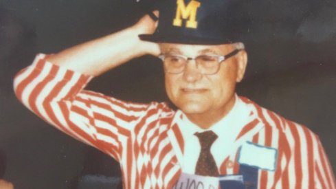 Woody Hayes wearing a Michigan hat.