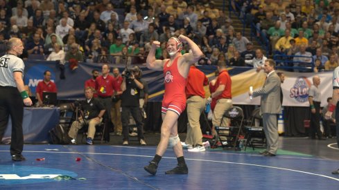 Bo Jordan flexes after a semifinals win over Cornell's Brian Realbuto.