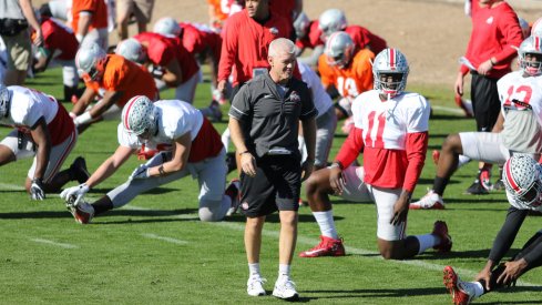 Ohio State cornerbacks coach Kerry Coombs walks through warmups at the Fiesta Bowl last season. 