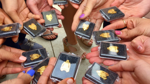 The Ohio State women's gymnastics team displays their gold leotards they received for beating Michigan.