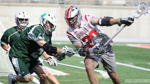 Ohio State's Eric Fannell moves against Loyola defenders in an NCAA Championship lacrosse game. 