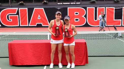 Francesca Di Lorenzo and Miho Kowase after winning the 2017 NCAA Women's Doubles championship.