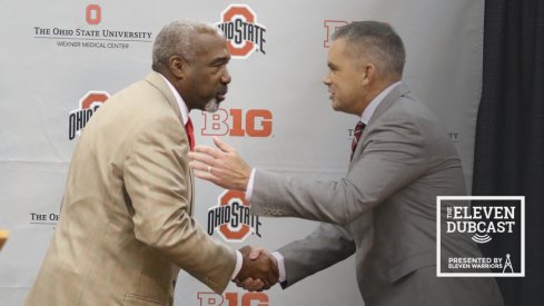 Ohio State athletic director Gene Smith shakes hands with men's basketball head coach Chris Holtmann