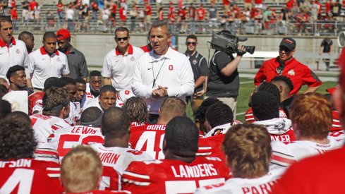 Urban Meyer talks to his team after the 2017 Ohio State spring football game.