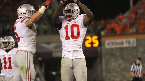 Sam Hubbard and Jalyn Holmes celebrate a fumble against Virginia Tech in 2015