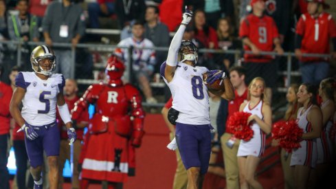 Sep 1, 2017; Piscataway, NJ, USA; Washington Huskies wide receiver Dante Pettis (8) celebrates his punt return touchdown during the first half of their game against the Rutgers Scarlet Knights at High Point Solutions Stadium. Mandatory Credit: Ed Mulholland-USA TODAY Sports