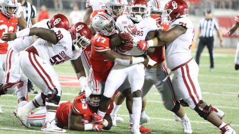 Jerome Baker tackles an Oklahoma ball carrier