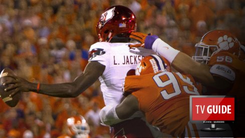 Oct 1, 2016; Clemson, SC, USA; Louisville Cardinals quarterback Lamar Jackson (8) is brought down by Clemson Tigers defensive end Clelin Ferrell (99) and defensive tackle Scott Pagano (56) during the first quarter at Clemson Memorial Stadium. Mandatory Credit: Joshua S. Kelly-USA TODAY Sports