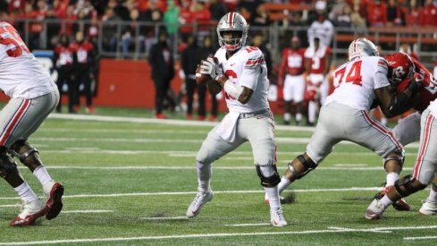 J.T. Barrett became Ohio State's career passing leader as the Buckeyes routed Rutgers.