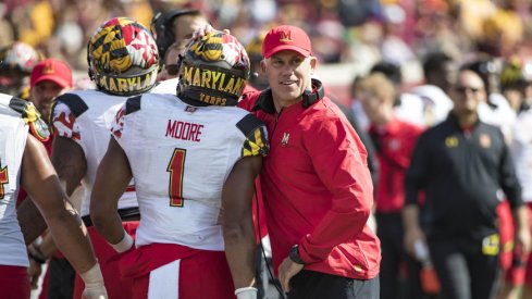 Sep 30, 2017; Minneapolis, MN, USA; Maryland Terrapins head coach DJ Durkin celebrates with wide receiver D.J. Moore (1) after a touchdown in the first half against the Minnesota Golden Gophers at TCF Bank Stadium. Mandatory Credit: Jesse Johnson-USA TODAY Sports