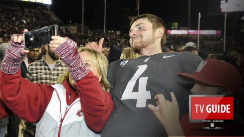 Sep 29, 2017; Pullman, WA, USA; Washington State Cougars quarterback Luke Falk (4) takes a selfie with a fan after a game against the USC Trojans during the second half at Martin Stadium. The Cougars won 30-27. Mandatory Credit: James Snook-USA TODAY Sports