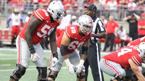 Matthew Burrell (69) played right guard alongside Billy Price (54) and Isaiah Prince (59) against Maryland.