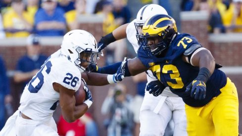 Maurice Hurst (73) and the Michigan Wolverines will look for another win over Saquon Barkley (26) and the Penn State Nittany Lions tonight.