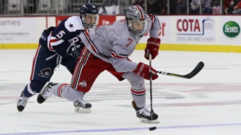 Buckeye defenseman Wyatt Ege carries the puck against Robert Morris. 