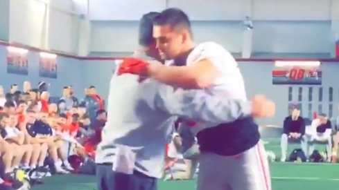 Sam Hubbard hugs Urban Meyer after Senior Tackle.