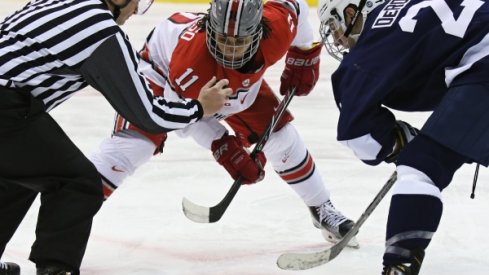 Buckeye forward Christian Lampasso faces off against Penn State.