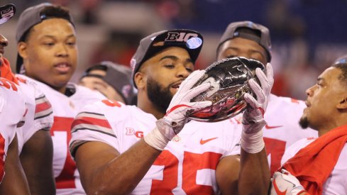 Chris Worley celebrates a Big Ten title.