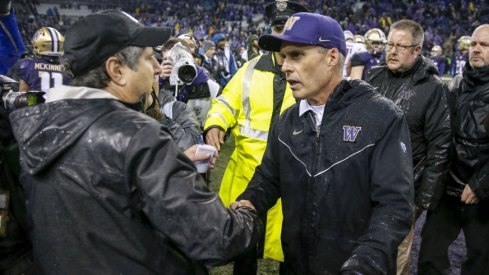 Nov 25, 2017; Seattle, WA, USA; Washington State Cougars head coach Mike Leach (left) shakes hands with Washington Huskies head coach Chris Petersen after their game at Husky Stadium. Mandatory Credit: Jennifer Buchanan-USA TODAY Sports