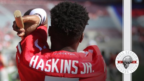 Dwayne Haskins Jr. stretches for the December 7th 2017 Skull Session.