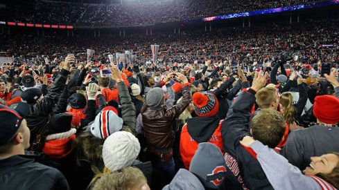 Ohio State fans celebrate on the Ohio Stadium field after the Buckeyes' 39-38 win over Penn State.