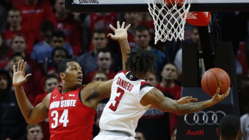 Kaleb Wesson defends a shot by Rutgers' Corey Sanders.