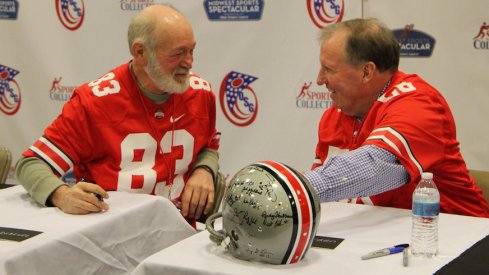 Former Ohio State defensive end Mark Debevc (83) and linebacker Dirk Worden (56), both members of the 1968 national championship team, at Saturday's autograph signing.