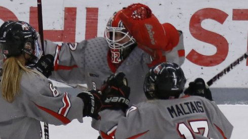 Kassidy Sauve, Emma Maltais, and Dani Sadek celebrate a big Buckeye women's hockey win.