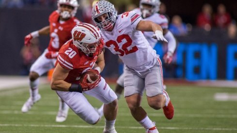 Middle linebacker Tuf Borland had seven stops versus Wisconsin in the Big Ten title game.