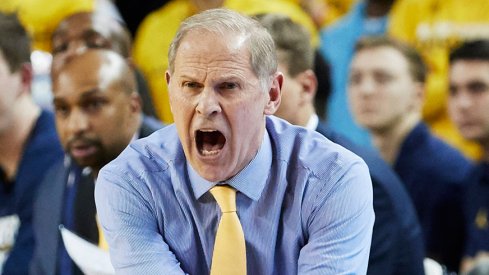 USA; Michigan Wolverines head coach  reacts on the sideline in the second half against the Northwestern Wildcats at Crisler Center. Mandatory Credit: 