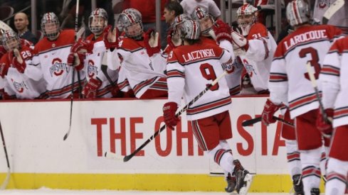 Tanner Laczynski celebrates a goal with his Buckeye teammates.