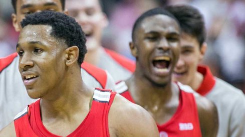 Ohio State's C.J. Jackson and Kam Williams celebrate their team's double overtime win at Indiana Friday night.