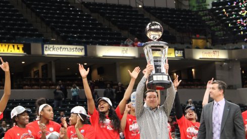 Kevin McGuff and the Ohio State women's basketball team celebrate their Big Ten Tournament championship.